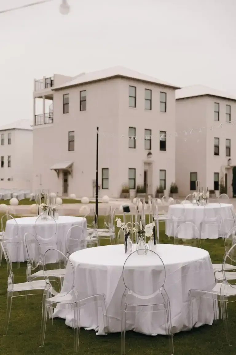 A place setting detail with white florals and candlelight