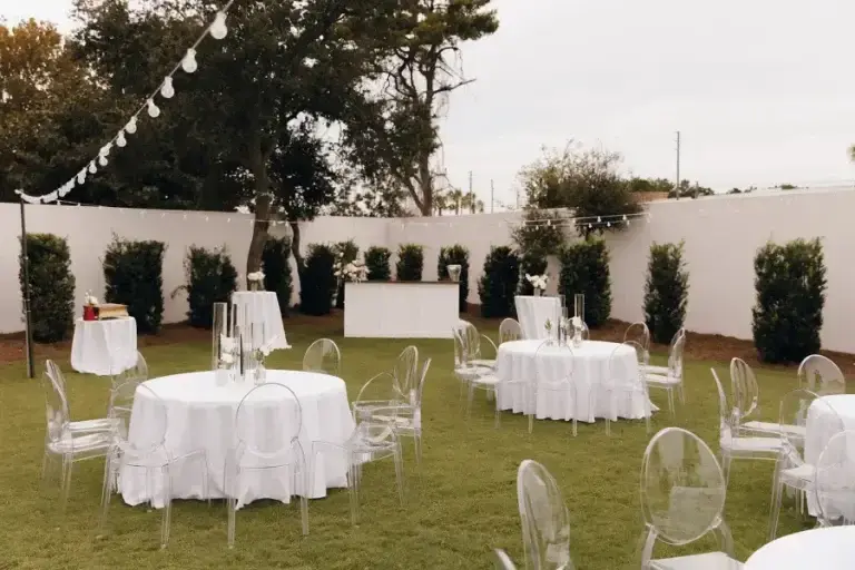 Evening reception seating on the green space between the homes