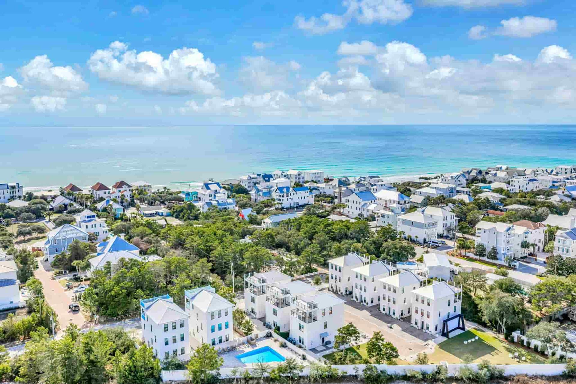 Aerial view over The Grove's rooftops toward the Gulf