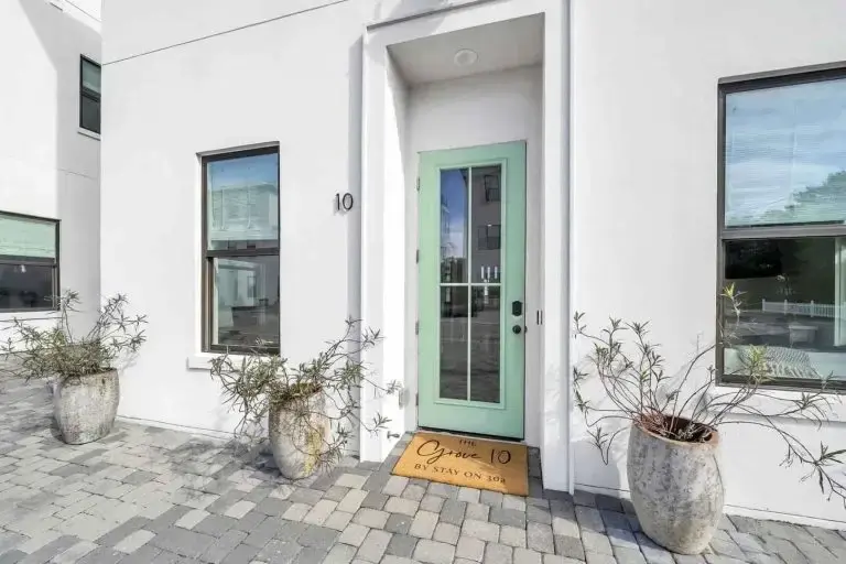 The shared lawn and gravel paths that connect the cottages