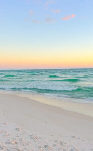 Pastel sunrise skies on 30A during fall vacation