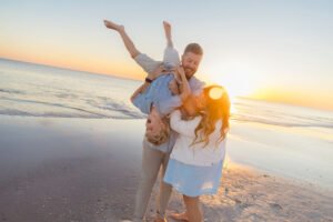 family walking along 30A shoreline during professional beach photos